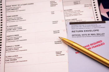 Official election vote by mail ballot with a gold pen focused on the presidential candidates with a shallow depth - San Jose, California, USA - October 8, 2020