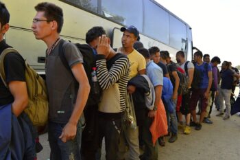 October 4, 2015; Bapska in Serbia. Group of refugees leaving Serbia. They came to Bapska by buses and then they leaving Serbia and go to Croatia and then to Germany. Many of them escapes from home because of civil war.