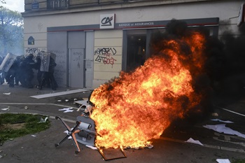 Masked protesters set garbage bins and bikes on fire amid clashes during a natiowide demonstration  in Paris, France on April 6, 2023.